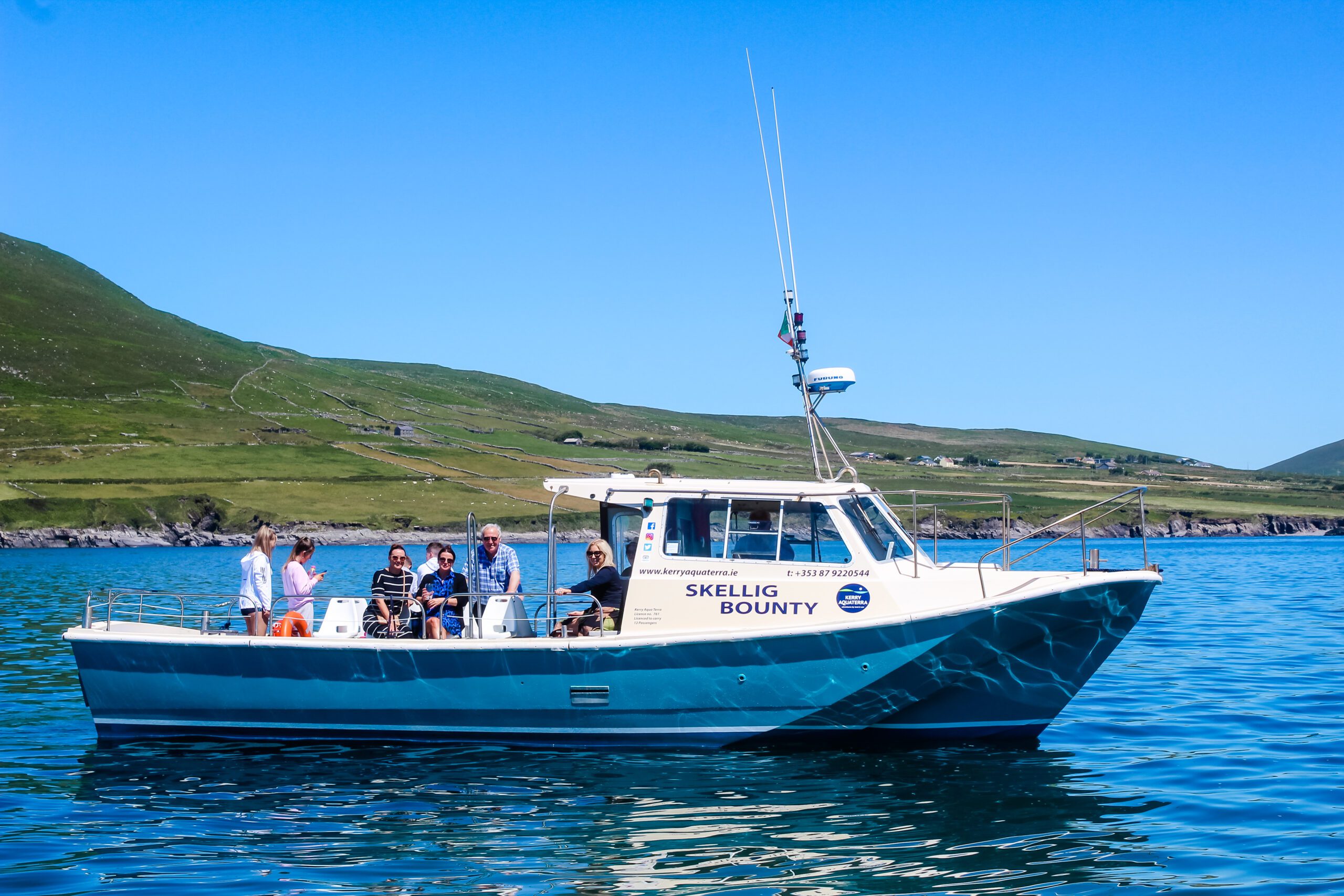 A family group abroad a private charter sailing along the Skellig coast